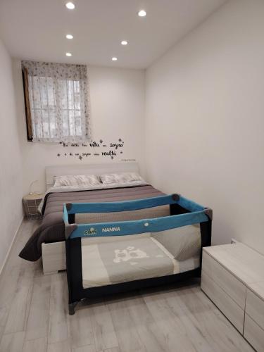 a bedroom with two beds in a room at La Casetta di Nonno Settimo in Palermo