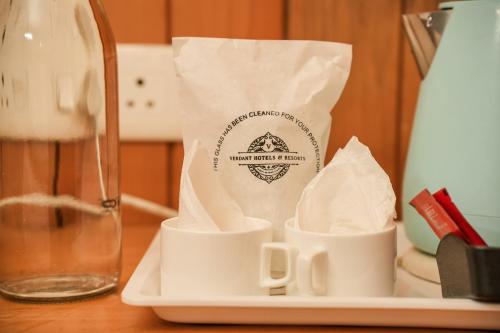 a bag of paper sitting on a table with cups at Verdant The Vintage in Lachung
