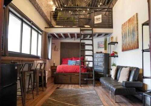 a loft bedroom with a bed and a bunk bed at Rivers Edge Lofts - Unit 5 in Niles