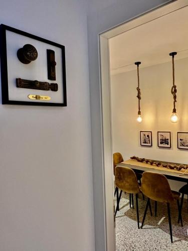 a dining room with a table and chairs and a mirror at Casa PIVA 781 in Chioggia