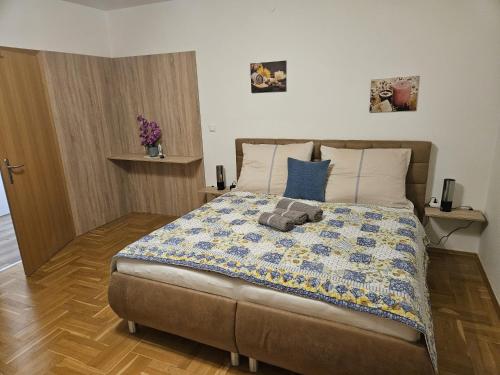 a bedroom with a bed with a teddy bear on it at Ferienwohnung 2 am Gleichenberger "Kogl" in Bad Gleichenberg