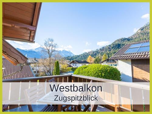 a balcony of a house with a view of the mountains at Ferienwohnung Rambold Sonnenterrasse in Garmisch-Partenkirchen