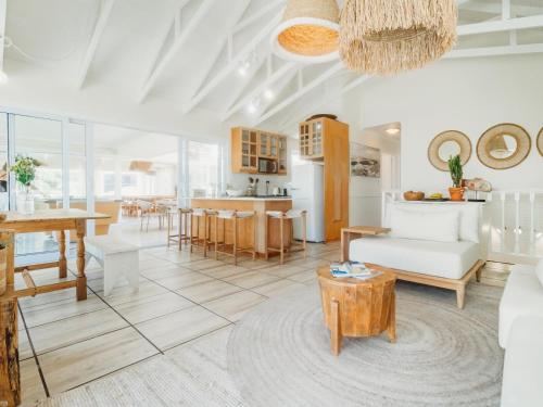 a living room with a couch and a table at Sun and Sea Glentana in Glentana