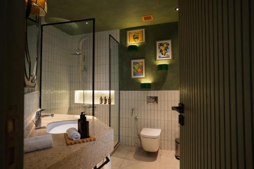a bathroom with a sink and a toilet at Good Days Habitat Soma Bay in Hurghada