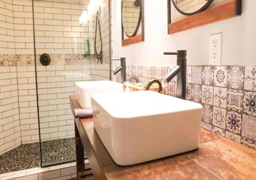 a bathroom with two sinks and a shower at Rivers Edge Lofts - Unit 4 in Niles