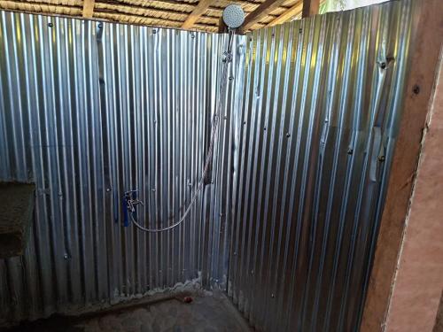 a metal wall with a hose attached to it at RENDER VOUS A'l MER in Puerto Princesa City