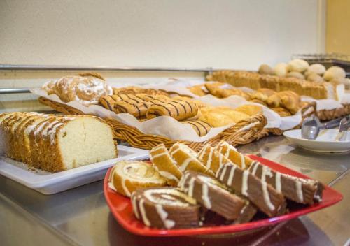 a table topped with different types of bread and pastries at 4Dreams Hotel Chimisay in Puerto de la Cruz