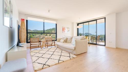 a living room with a couch and a table at ALLONBAY dream apartment in Villajoyosa