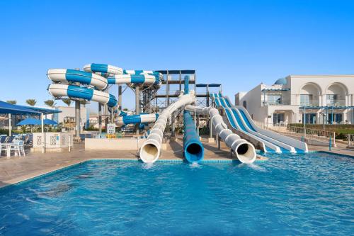 a water slide in a pool at a resort at Pickalbatros Palace Sharm "Aqua Park"- All inclusive in Sharm El Sheikh