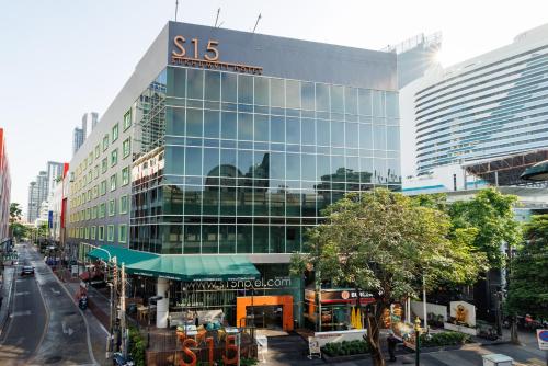 a building with a sks laboratories sign on it at S15 Sukhumvit Hotel in Bangkok