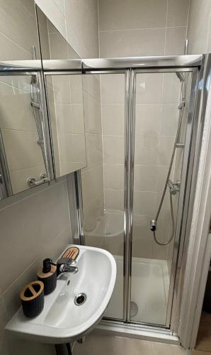 a bathroom with a sink and a shower at Central quality point piccadilly in London