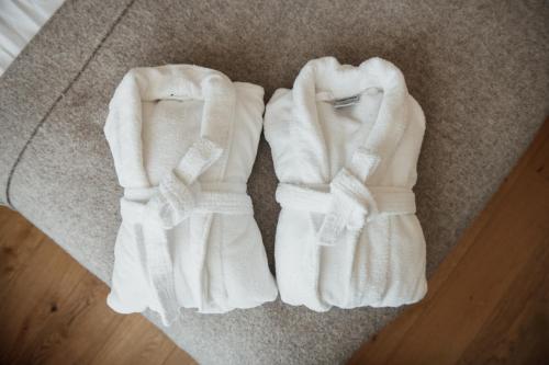 a pair of white gloves sitting on the floor at Home Hotel Victoria in Jönköping