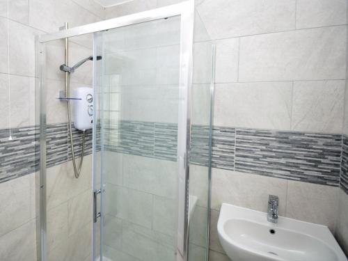 a bathroom with a shower and a sink at 2 Bed in Swansea oc-88744 in Knelston