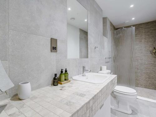 a white bathroom with a sink and a toilet at 2 Bed in Cowbridge oc-88000 in Llandow