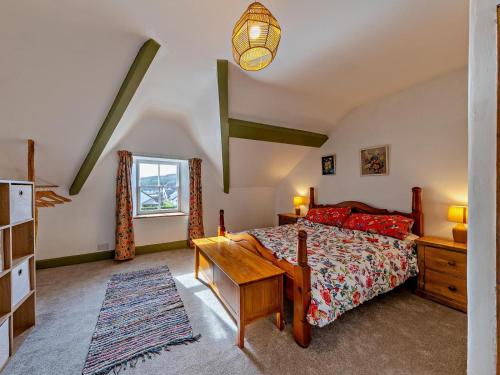 a bedroom with a bed and a desk and a window at 4 Bed in Bala oc-94665 in Bala