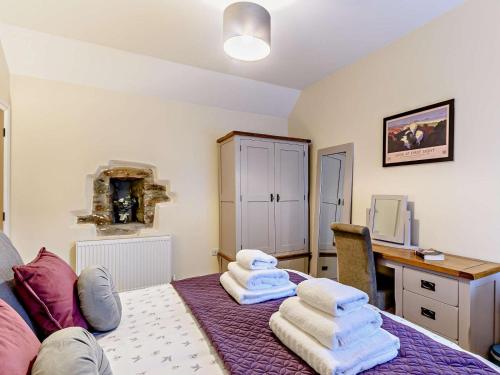 a room with a table with towels on top of it at 1 Bed in Kilgetty oc-59667 in Yerbeston