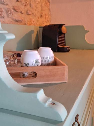 a wooden shelf with two dishes on top of a counter at Casa Zampani in Massa Martana