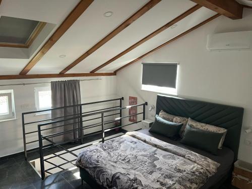 a bedroom with a bed in a room at Amorino Apartman Studio in Opatija