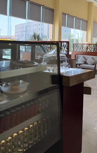 a display case in a restaurant with food at Noon Hotel Suites in Khafji
