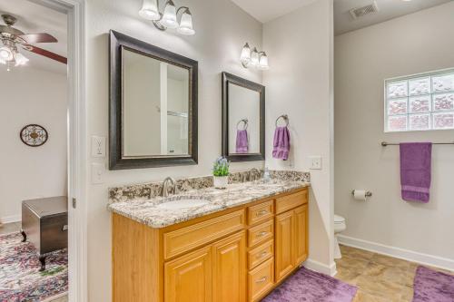 a bathroom with a sink and a mirror at Private Pool + Patio: Pensacola Family Home! in Perdido Key