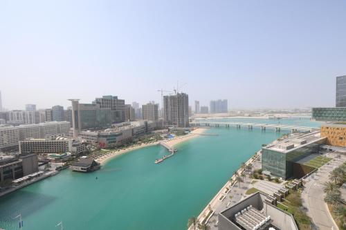an aerial view of a river in a city at Maryah Island Luxe 1 Bed Junior by Central Stay in Abu Dhabi