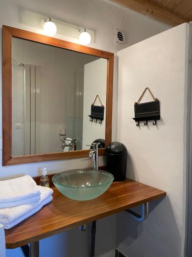a bathroom with a sink and a mirror at Escapade Maritime in Dompierre-sur-Mer
