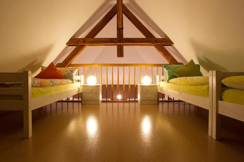 a room with two beds and two lights in it at Dreiurtshof Fewo 2 in Remplin