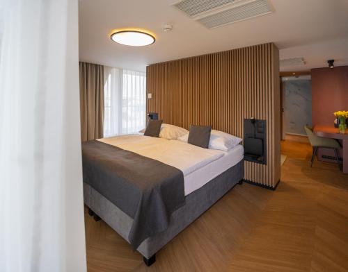 a bedroom with a bed and a table in a room at Botel Marina in Prague