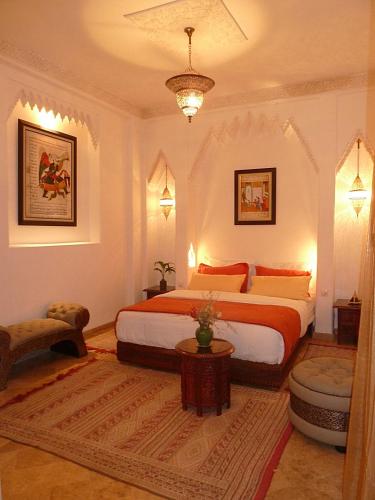 a bedroom with a large bed in a room at Riad Viva in Marrakesh