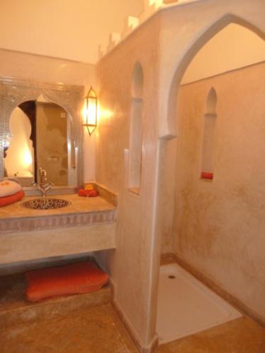 a bathroom with a sink and a mirror at Riad Viva in Marrakesh