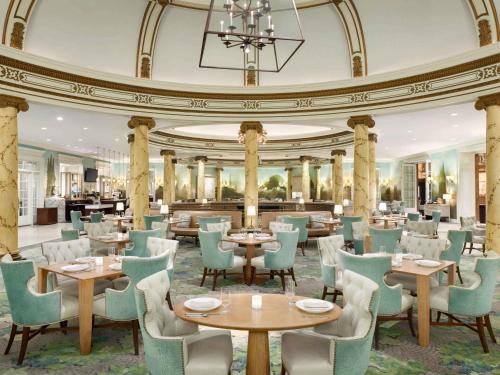 a restaurant with tables and chairs and a ceiling at Fairmont San Francisco in San Francisco