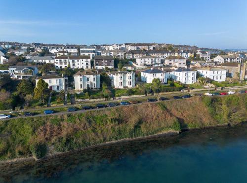 an aerial view of a town next to a body of water at Riversdale in Falmouth