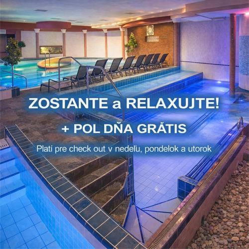 a swimming pool in a hotel with a sign that reads zoss estimate a relax at Therma Nea Dunajská Streda in Dunajská Streda