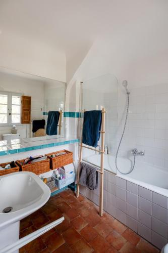 a bathroom with a shower and a sink and a tub at Contemporary bastide in Aix in Aix-en-Provence