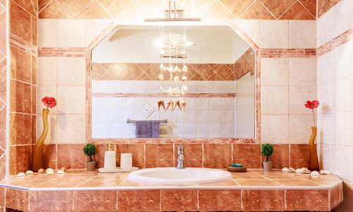 a bathroom with a sink and a mirror at Philoxenia House in Sidirokastro