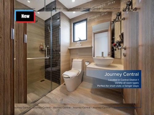 a bathroom with a toilet and a sink and a shower at Journey Central - Ho Chi Minh City - SOHO RESIDENCE in Ho Chi Minh City
