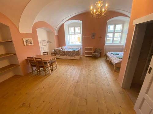 a room with a table and a dining room at Klášter Nová Říše in Nová Říše