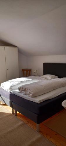 a large bed in a room with at Haus Ollie in Matrei in Osttirol