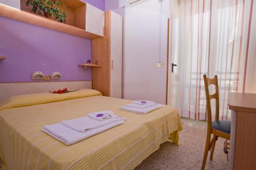 Postel nebo postele na pokoji v ubytování Hotel Moja