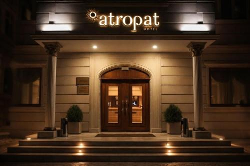 a entrance to a hotel with a sign above the door at Atropat Old City Hotel in Baku