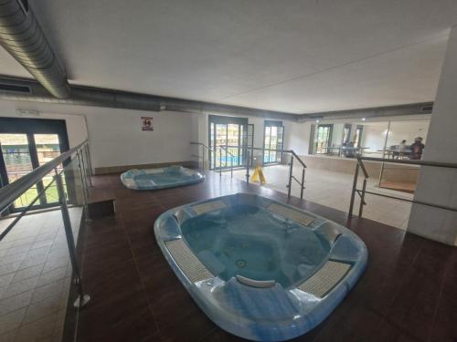 a jacuzzi tub in the middle of a room at Playa Reinante SPA in Barreiros