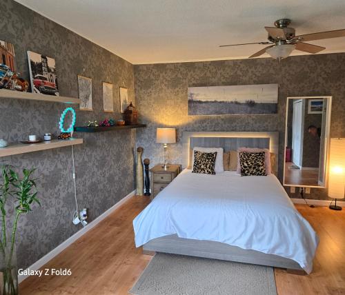 a bedroom with a large white bed in it at Wallace getaway in Delta
