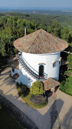 an aerial view of a building with a roof at O Moinho de Vale da Mó in Anadia