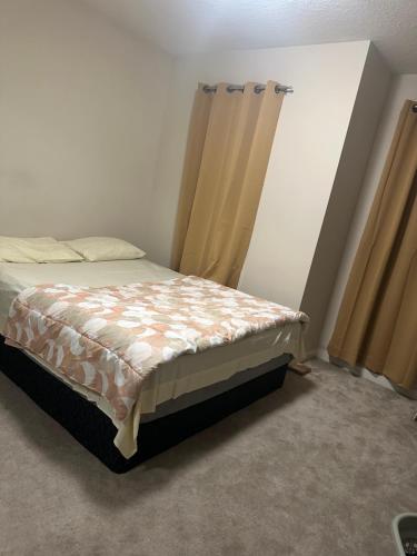 a bedroom with a bed in a room at Your private room CozyVibe in Edmonton