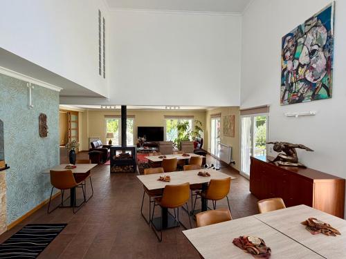 a restaurant with tables and chairs in a room at Casa Carvalhal - Adults Only in Góis