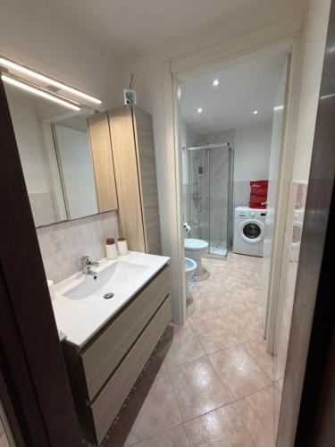 a bathroom with a sink and a toilet at Residenza il Sole in Bologna