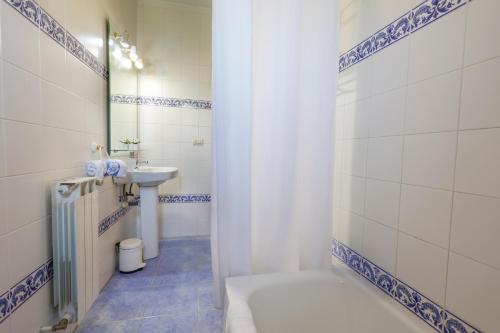a bathroom with a toilet and a sink at LOPENEA Baztan in Garzáin