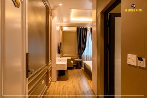 a room with a bathroom with a toilet and a door at Harmony Hotel Nam Định in Như Thức