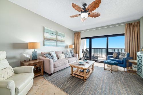 a living room with a couch and a table at The Palms West Unit 515 in Orange Beach