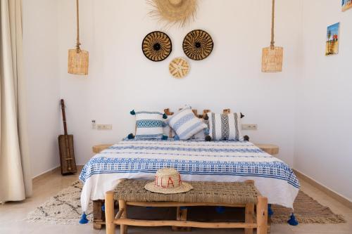 a bedroom with a bed with a hat on a table at Villa Luxury Spacious Moroccan ,Private Pool in Essaouira